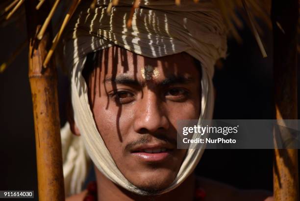 Portrait of Nepalese devotee walks around town during the Swasthani Brata Katha festival or Madhav Narayan Festival celebrated in Thecho, Lalitpur,...