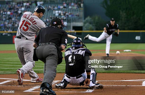 Matt Holliday of the St. Louis Cardinals grounds out to first base off of starting pitcher Aaron Cook of the Colorado Rockies to end the first inning...