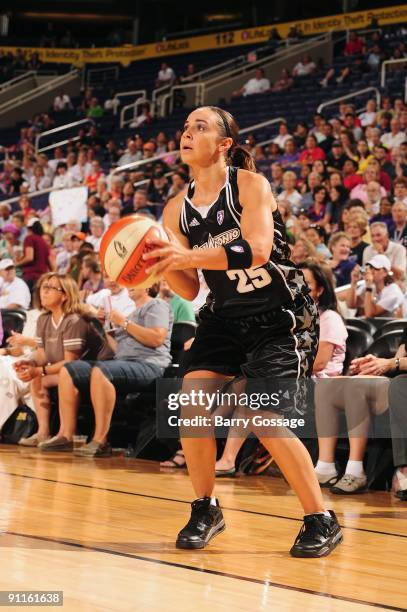 Becky Hammon of the San Antonio Silver Stars takes a jump shot against Diana Taurasi of the Phoenix Mercury during Game Three of the WNBA Western...