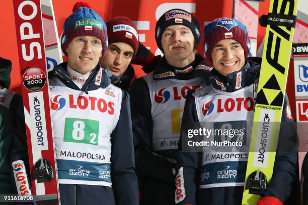 Stefan Hula, Maciej Kot, Dawid Kubacki and Kamil Stoch of Poland celebrate after they win the Large Hill Team competition at the FFIS Ski Jumping...