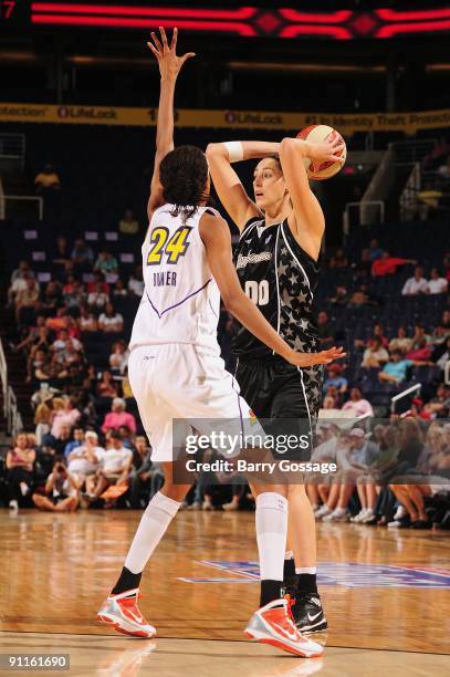 Ruth Riley of the San Antonio Silver Stars looks to move the ball against DeWanna Bonner of the Phoenix Mercury during Game Three of the WNBA Western...