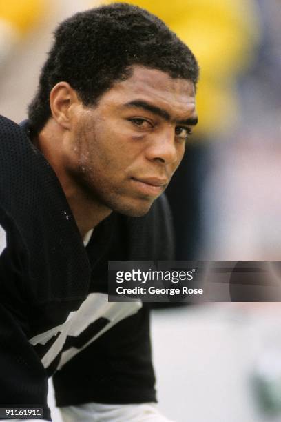 Marcus Allen of the Los Angeles Raiders looks on from the sideline during the AFC Championship game against the Seattle Seahawks at the Los Angeles...