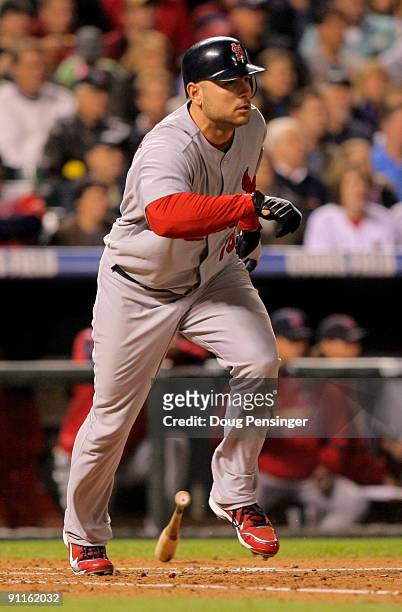 Matt Holliday of the St. Louis Cardinals singles in the sixth inning off of relief pitcher Jose Contreras of the Colorado Rockies at Coors Field on...