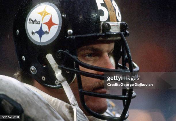 Linebacker Jack Lambert of the Pittsburgh Steelers looks on from the sideline during a game against the Cleveland Browns at Cleveland Municipal...