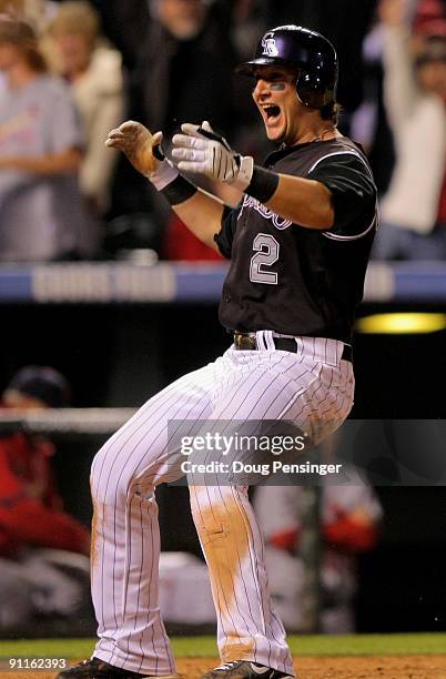 Shortstop Troy Tulowitzki of the Colorado Rockies celibrates after scoring the game-winning run against the St. Louis Cardinals on a sacrifice fly by...