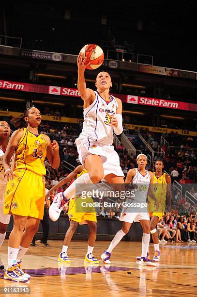 Diana Taurasi of the Phoenix Mercury shoots against Tina Thompson of the Los Angeles Sparks in Game Two of the WNBA Western Conference Finals played...