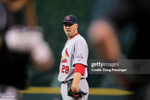 Starting pitcher Chris Carpenter of the St. Louis Cardinals delivers against the Colorado Rockies at Coors Field on September 25, 2009 in Denver,...