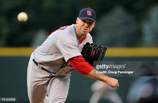 Starting pitcher Chris Carpenter of the St. Louis Cardinals delivers against the Colorado Rockies at Coors Field on September 25, 2009 in Denver,...