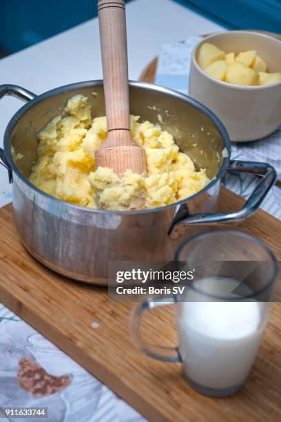 making traditional shepherds pie - potato masher stock pictures, royalty-free photos & images