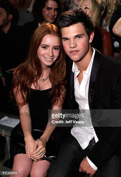 Actors Lily Collins and Taylor Lautner pose during the 7th Annual Teen Vogue Young Hollywood Party held at Milk Studios on September 25, 2009 in...