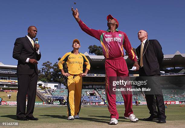Floyd Reifer of West Indies tosses the coin with commentator Ian Bishop Ricky Ponting of Australia and match referee Jeff Crowe looking on during the...