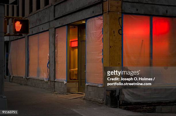 red construction glow - joseph o. holmes stock pictures, royalty-free photos & images