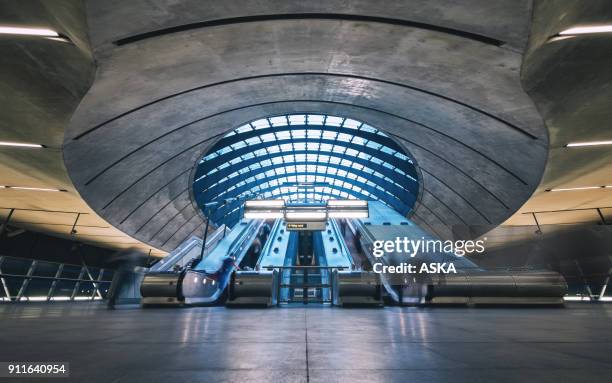 subway station escalators, canary wharf, london, england - crowded underground london stock pictures, royalty-free photos & images