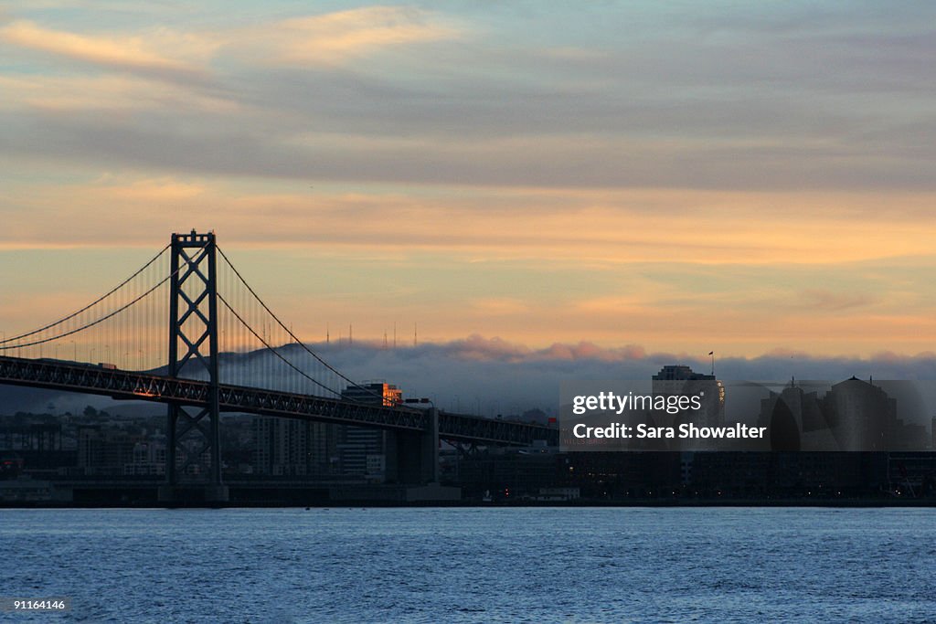 Sunset Bay Bridge with fog rolling in