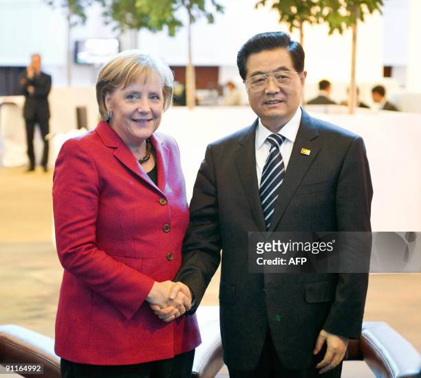 German Chancellor Angela Merkel shakes hands with Chinese President Hu Jintao prior to bilateral talks during the G20 summit on September 25, 2009 in...