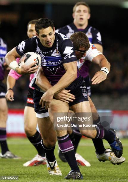 Billy Slater of the Storm breaks through a tackle during the second NRL Preliminary Final match between the Melbourne Storm and the Brisbane Broncos...