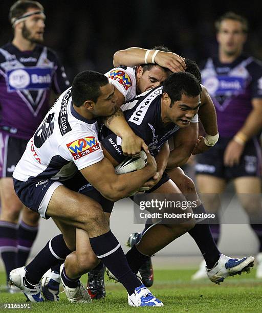 Adam Blair of the Storm is tackled during the second NRL Preliminary Final match between the Melbourne Storm and the Brisbane Broncos at Etihad...