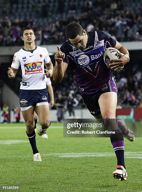 Greg Inglis of the Storm scores a try during the second NRL Preliminary Final match between the Melbourne Storm and the Brisbane Broncos at Etihad...