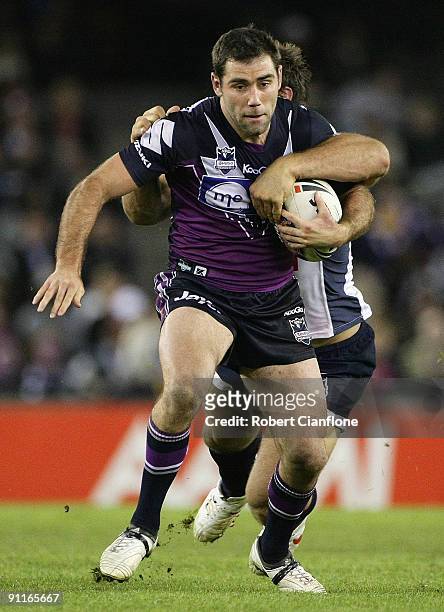 Cameron Smith of the Storm is tackled during the second NRL Preliminary Final match between the Melbourne Storm and the Brisbane Broncos at Etihad...