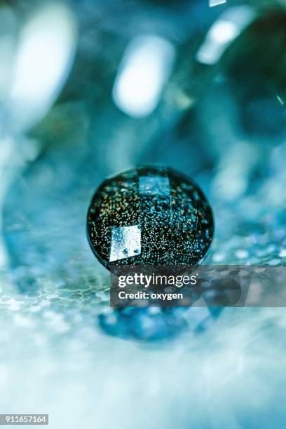 crystal button on aqua bokeh background - button sewing item 個照片及圖片檔