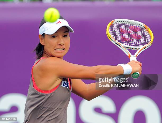 Kimiko Date-Krumm of Japan returns to Maria Kirilenko of Russia during their semi-final match at the Korea Open Tennis championship in Seoul on...