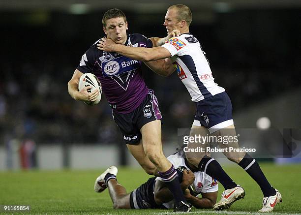 Ryan Hoffman of the Storm is tacked during the second NRL Preliminary Final match between the Melbourne Storm and the Brisbane Broncos at Etihad...