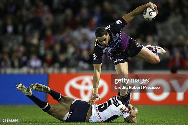 Greg Inglis of the Storm is tacked by Jharal Yow Yeh of the Broncos during the second NRL Preliminary Final match between the Melbourne Storm and the...