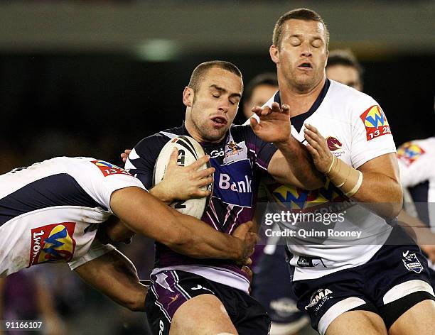 Steve Turner of the Storm is tackled during the second NRL Preliminary Final match between the Melbourne Storm and the Brisbane Broncos at Etihad...