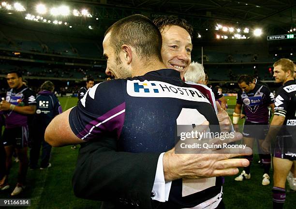 Steve Turner of the Storm and Storm coach Craig Bellamy celebrate after the second NRL Preliminary Final match between the Melbourne Storm and the...