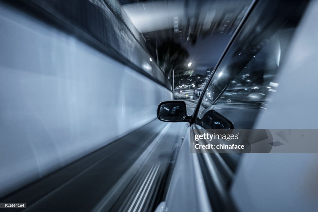 Car driving at night in downtown sydney