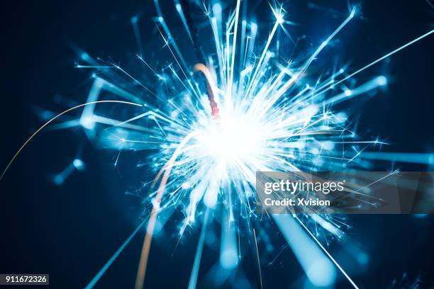 sparks macro shot - gold sparks stock pictures, royalty-free photos & images