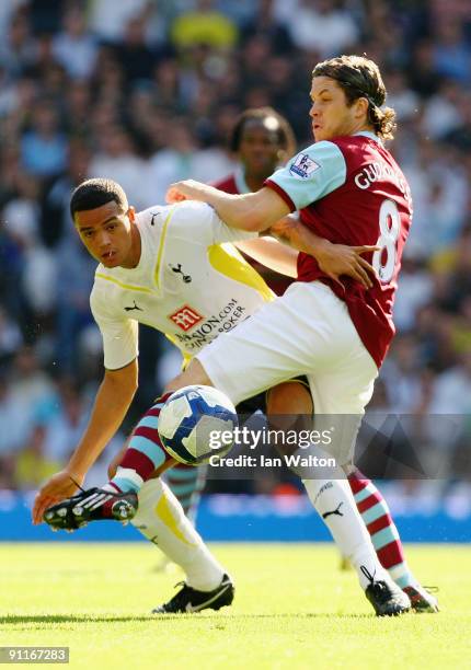 Joey Gudjonsson of Burnley challenges Jermaine Jenas of Tottenham Hotspur during the Barclays Premier League match between Tottenham Hotspur and...