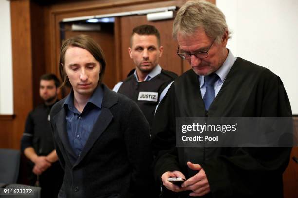 Defendant Sergej W. And his lawyers Carl W. Heydenreich stand in the dock of the district court as he arrives for trial on 28 charges of attempted...