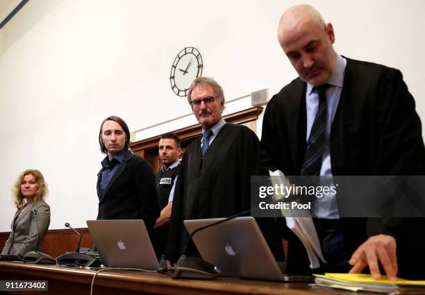 Defendant Sergej W. And his lawyers Carl W. Heydenreich and Christos Psaltiras stand in the dock of the district court as he arrives for trial on 28...