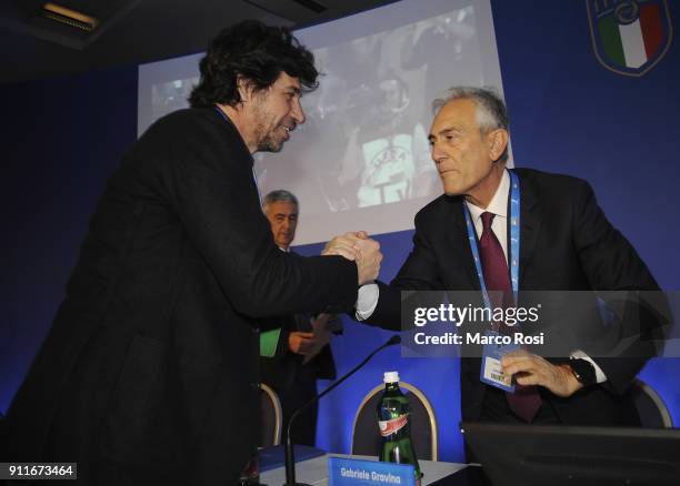 Demetrio Albertini shakes the hands with Gabriele Gravina during the Italian Football Federation new president elections on January 29, 2018 in Rome,...