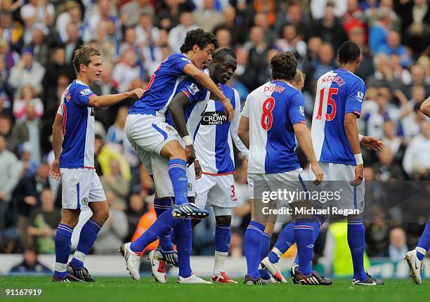 Chris Samba of Blackburn celebrates scoring to make it 1-1 with team mates during the Barclays Premier League match between Blackburn Rovers and...