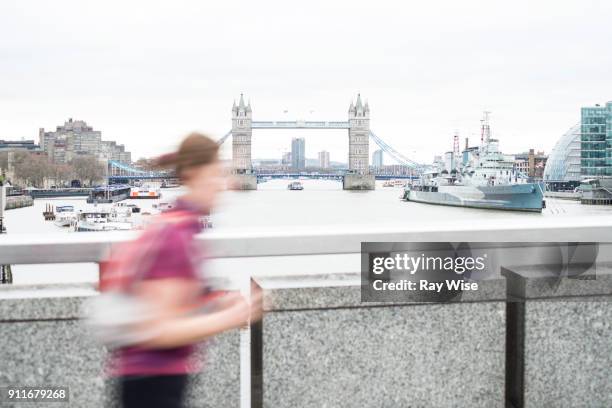 runner on london bridge overlooking the thames - january 2018 stock pictures, royalty-free photos & images