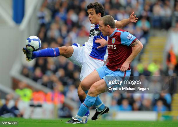 Franco Di Santo of Blackburn is challenged by Richard Dunn of Aston Villa during the Barclays Premier League match between Blackburn Rovers and Aston...