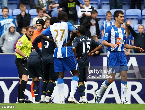 Petr Cech of Chelsea is sent off by referee Phil Dowd during the Barclays Premier League match between Wigan Athletic and Chelsea at DW Stadium on...