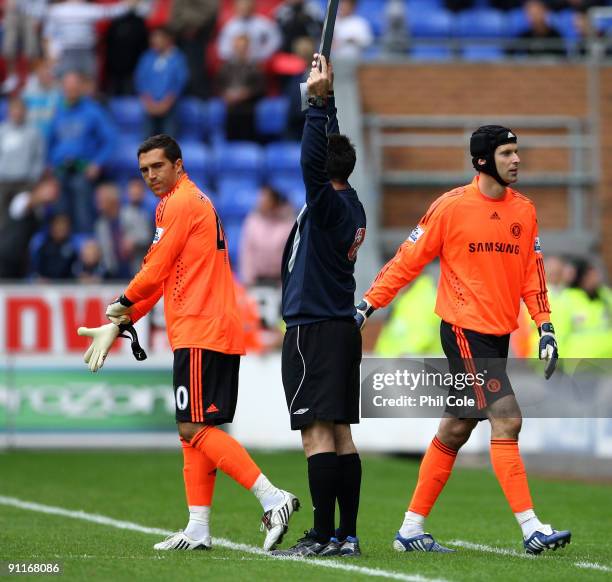 Petr Cech of Chelsea is sent off and changes with Henrique Hilario during the Barclays Premier League match between Wigan Athletic and Chelseaat DW...