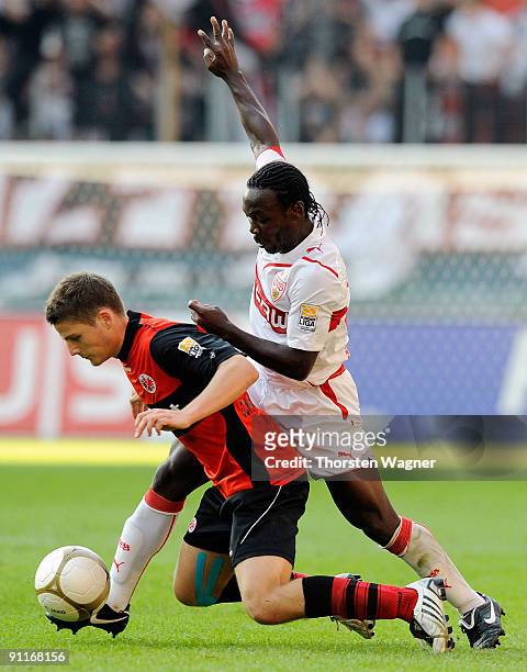 Pirmin Schwegler of Frankfurt battles for the ball with Arthur Boka of Stuttgart during the Bundesliga match between Eintracht Frankfurt and VFB...