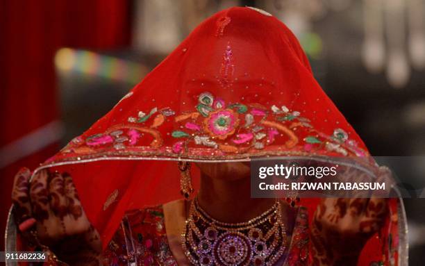 Pakistani Hindu bride attends a mass wedding ceremony in Karachi on January 28, 2018. The 10th Annual Hindu Combined Marriages Ceremony with 83...