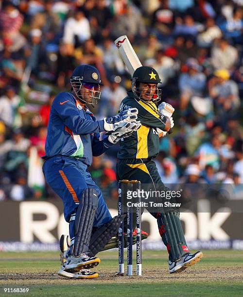 Shoaib Malik of Pakistan hits out during the ICC Champions Trophy group A match between India and Pakistan at Centurion on September 26, 2009 in...