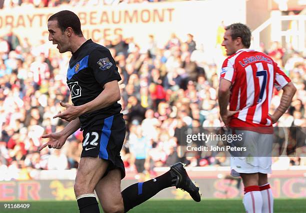 John O'Shea of Manchester United celebrates scoring their second goal during the Barclays FA Premier League match between Stoke CIty and Manchester...