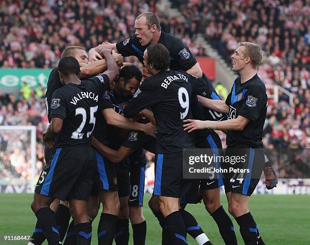 John O'Shea of Manchester United celebrates scoring their second goal during the Barclays FA Premier League match between Stoke CIty and Manchester...