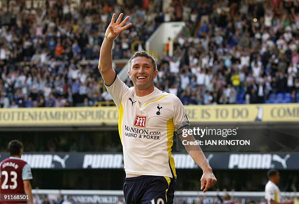 Tottenham Hotspur's Irish player Robbie Keane celebrates scoring his fourth goal during the English Premier League football match between Tottenham...