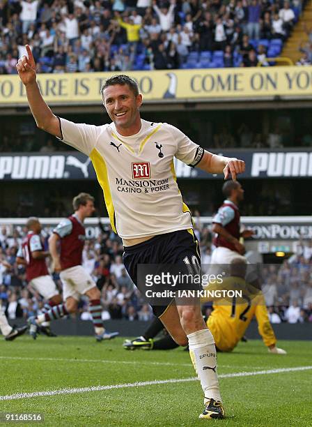 Tottenham Hotspur's Irish player Robbie Keane celebrates scoring his fourth goal during the English Premier League football match between Tottenham...