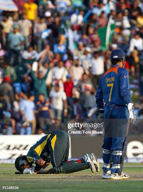 Shoaib Malik of Pakistan kisses the ground after reaching his century during the ICC Champions Trophy group A match between India and Pakistan at...