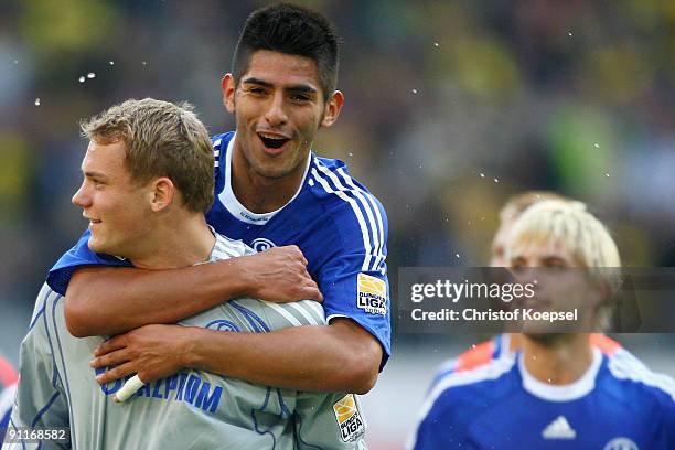 Goalkeeper Manuel Neuer and Carlos Zambrano of Schalke celebrate the 1-0 victory after the Bundesliga match between Borussia Dortmund and FC Schalke...