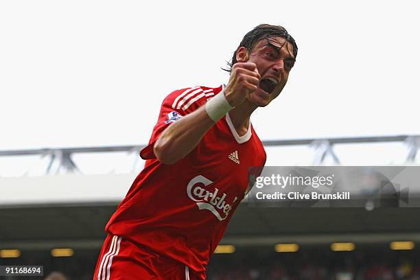 Albert Riera of Liverpool celebrates his team's sixth goal during the Barclays Premier League match between Liverpool and Hull City at Anfield on...